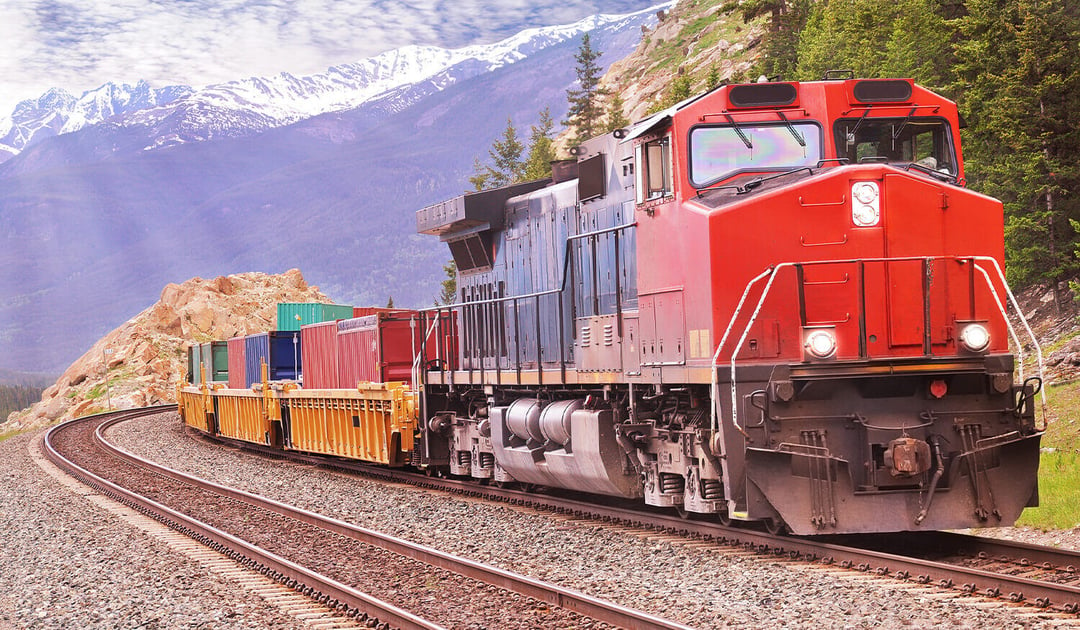 Intermodal Train Snow Capped Mountains