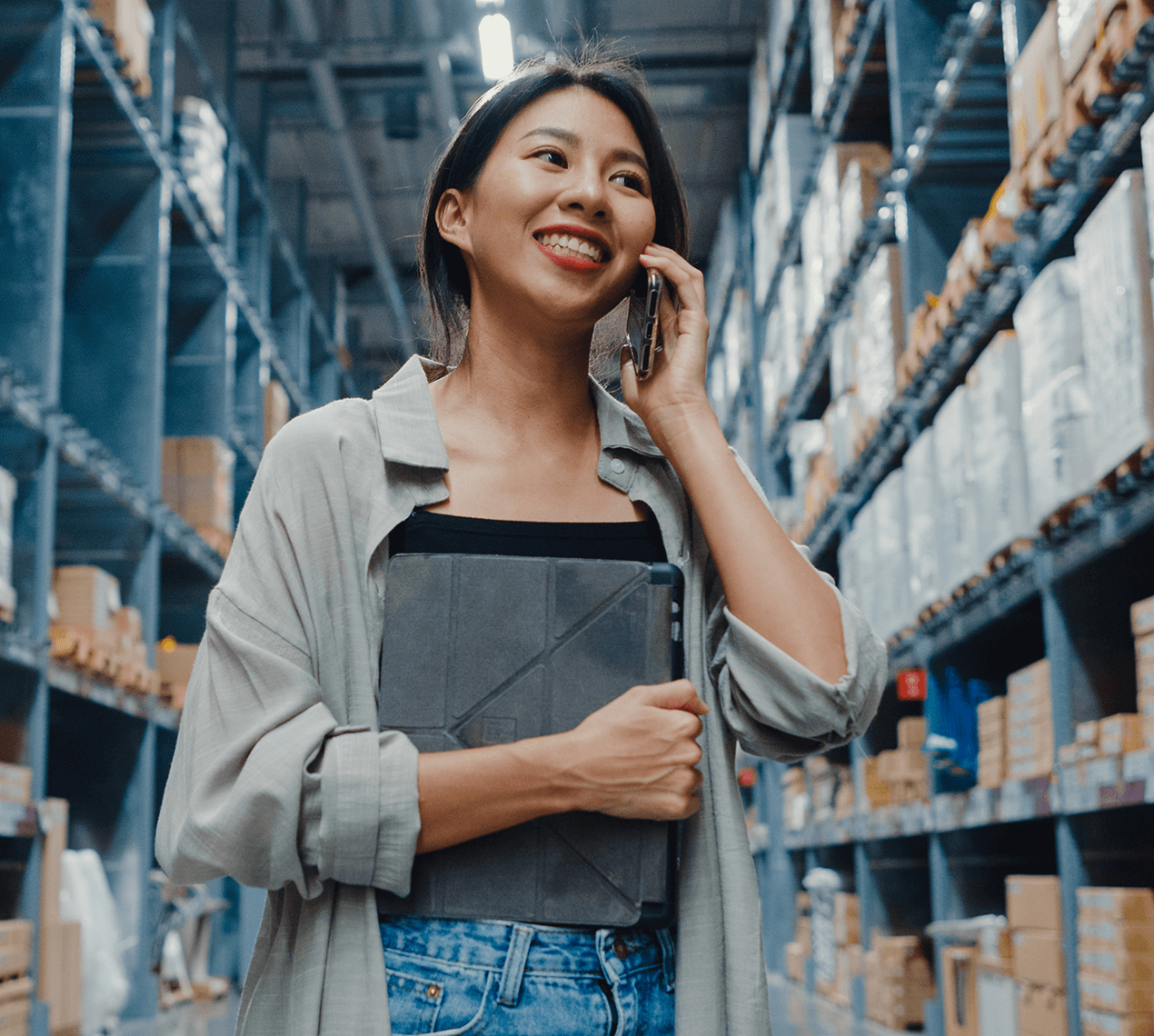 woman on iPhone in warehouse